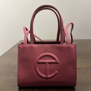 Small Telfar bag in the color “corned beef”.